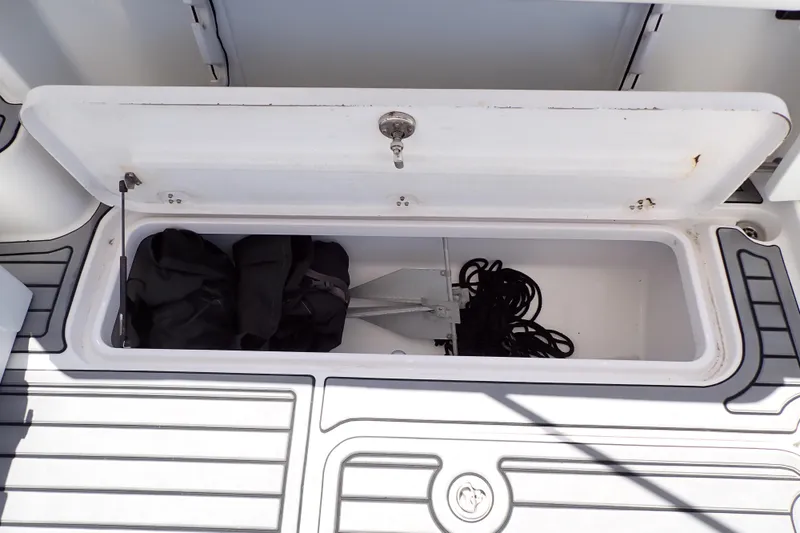 Slide: The Image of Storage compartment on 2014 Pro-Line 32 Express boat with anchor and ropes. - 50