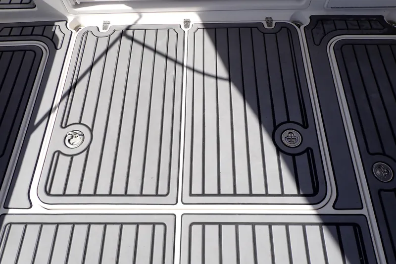 Slide: The Image of 2014 Pro-Line 32 Express boat deck with sleek, modern design and secure latches. - 51