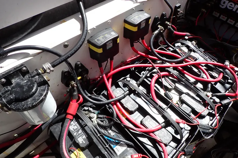 Slide: The Image of Electrical system of a 2014 Pro-Line 32 Express boat with batteries and wiring. - 57