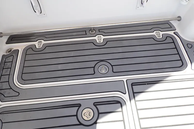 Slide: The Image of 2014 Pro-Line 32 Express boat deck with sleek, modern design and secure fittings. - 59