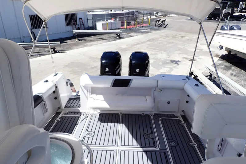 Slide: The Image of 2014 Pro-Line 32 Express boat interior with twin Mercury outboard engines. - 6