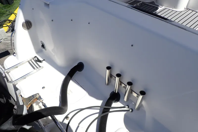Slide: The Image of 2014 Pro-Line 32 Express boat deck with rod holders and ladder. - 63