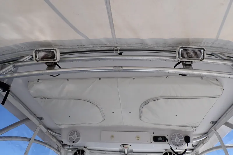 Slide: The Image of 2014 Pro-Line 32 Express boat interior ceiling with lights and speakers. - 64