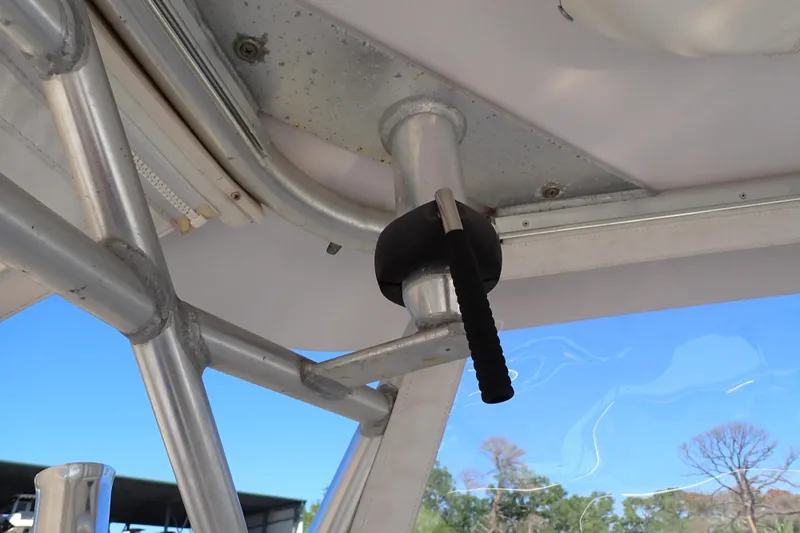 Slide: The Image of 2014 Pro-Line 32 Express boat interior showing metal framework and handle detail. - 65