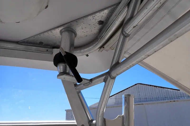 Slide: The Image of Close-up of 2014 Pro-Line 32 Express boat's metal framework under clear blue sky. - 66