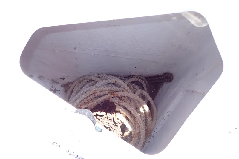 Slide: The Image of Rope storage compartment on a 2014 Pro-Line 32 Express boat. - 70