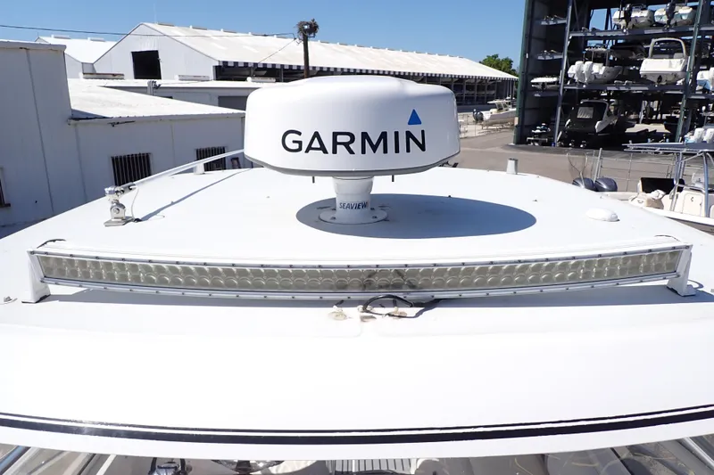 Slide: The Image of 2014 Pro-Line 32 Express boat with Garmin radar and LED light bar on deck. - 71