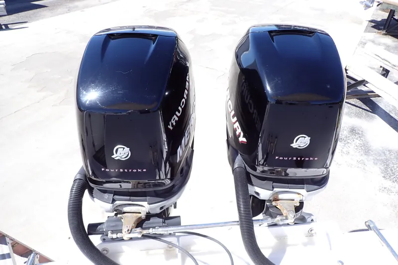 Slide: The Image of Twin Mercury FourStroke engines on a 2014 Pro-Line 32 Express boat. - 72