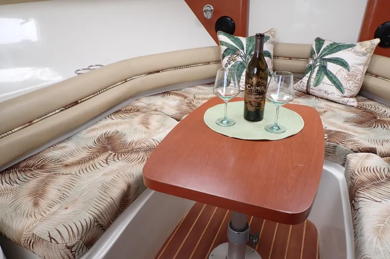 Slide: The Image of Luxurious 2014 Pro-Line 32 Express cabin with wine, glasses, and tropical decor. - 73