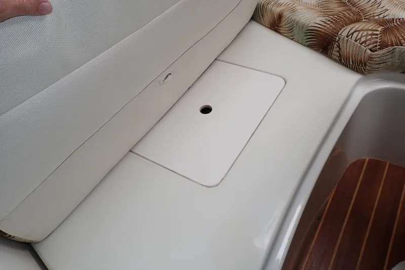 Slide: The Image of Interior seating and storage area of a 2014 Pro-Line 32 Express boat. - 74