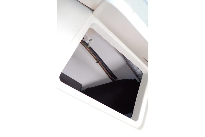 Slide: The Image of Storage compartment inside 2014 Pro-Line 32 Express boat, showcasing interior details. - 75