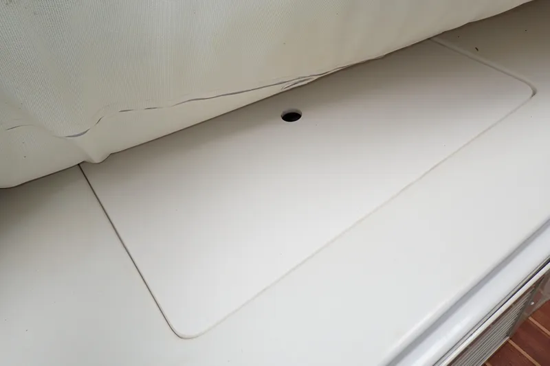 Slide: The Image of Storage compartment on a 2014 Pro-Line 32 Express boat. - 77