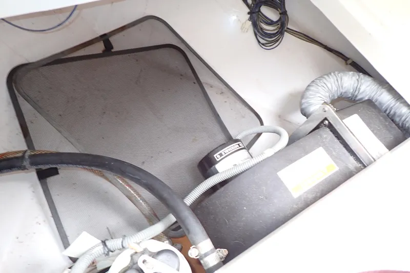 Slide: The Image of 2014 Pro-Line 32 Express engine compartment with wiring and ventilation components. - 78