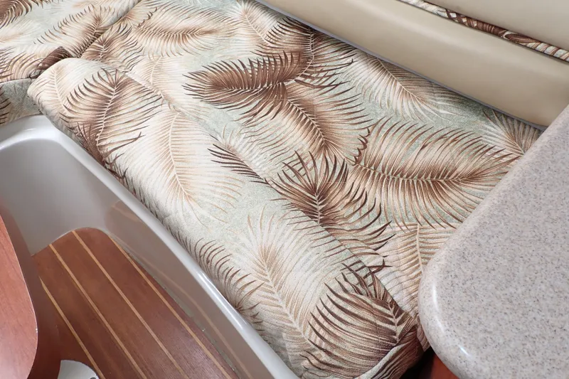 Slide: The Image of 2014 Pro-Line 32 Express interior with tropical-patterned upholstery and wooden flooring. - 79