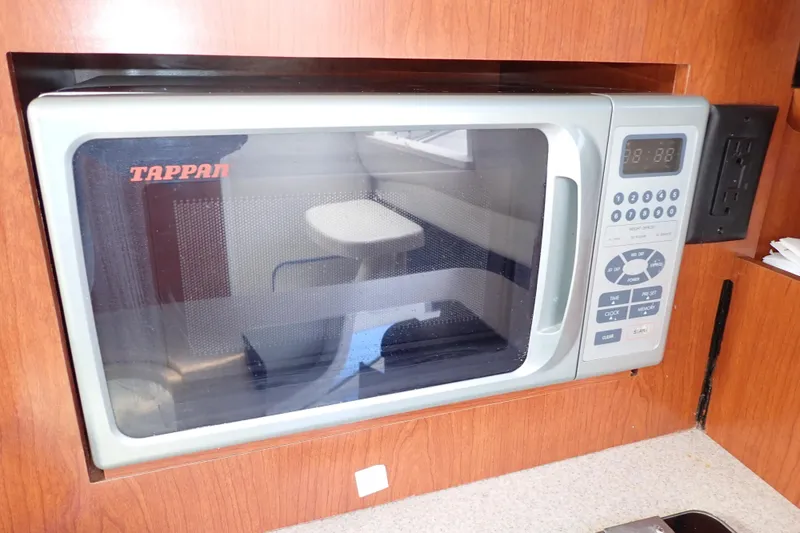 Slide: The Image of Tappan microwave in 2014 Pro-Line 32 Express boat kitchen setup. - 84
