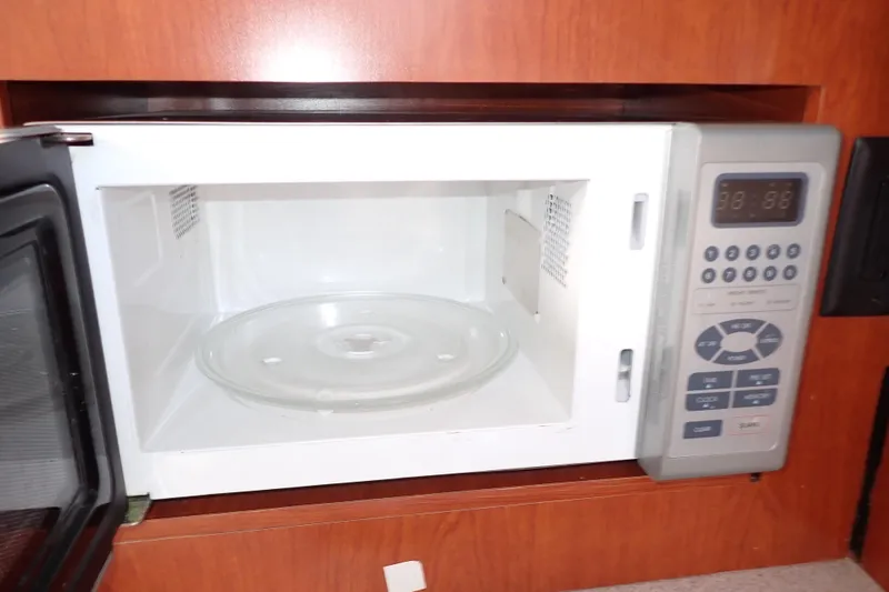 Slide: The Image of Microwave oven inside 2014 Pro-Line 32 Express boat kitchen area. - 85