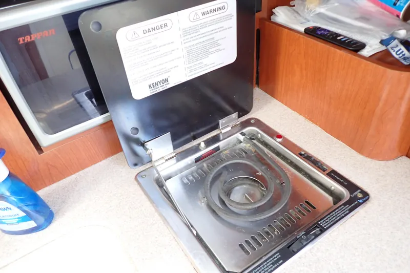 Slide: The Image of Kenyon stove in 2014 Pro-Line 32 Express boat kitchen, with safety warnings visible. - 86