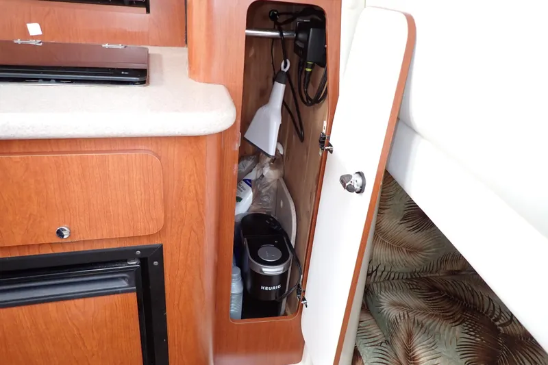 Slide: The Image of Cabinet interior of 2014 Pro-Line 32 Express with Keurig coffee maker. - 93