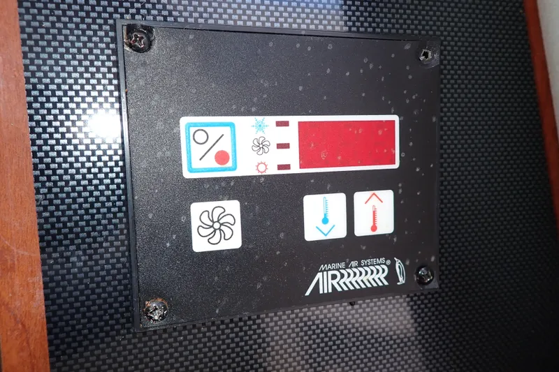 Slide: The Image of Control panel of a 2014 Pro-Line 32 Express boat's marine air system. - 98