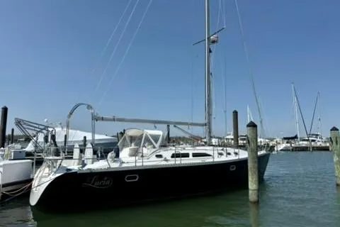 The Image of 2002 Catalina 400 MkII sailboat docked in a marina under clear blue skies. - 0