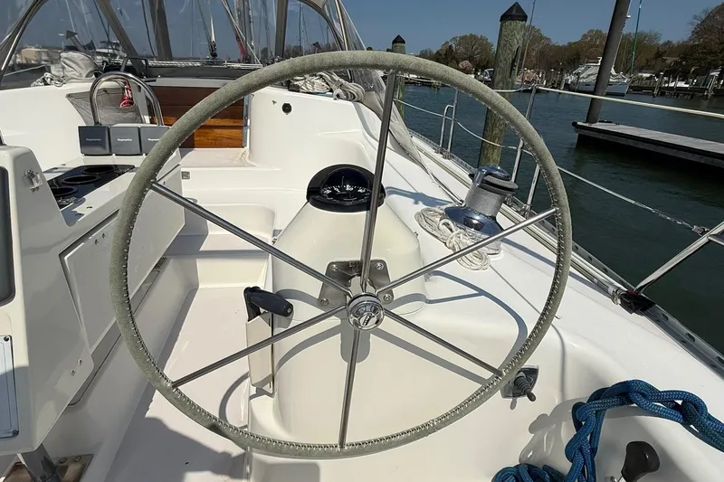 Slide: The Image of Steering wheel of a 2002 Catalina 400 MkII sailboat, docked at a marina. - 17