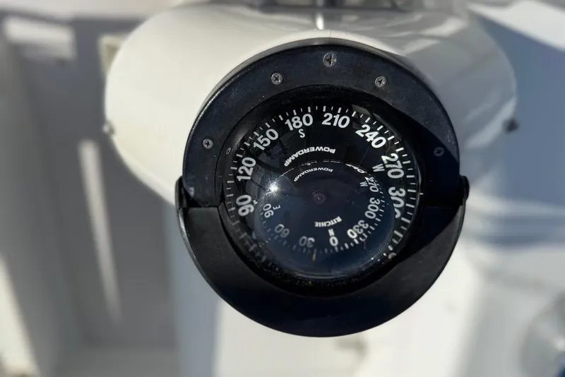 Slide: The Image of Compass on a 2002 Catalina 400 MkII sailboat, displaying cardinal directions. - 23