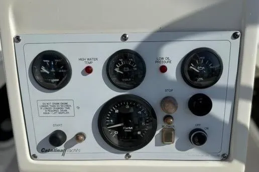 Slide: The Image of Control panel of a 2002 Catalina 400 MkII yacht with gauges and indicators. - 24