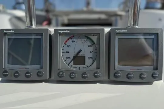 Slide: The Image of Raymarine navigation instruments on a 2002 Catalina 400 MkII sailboat dashboard. - 25