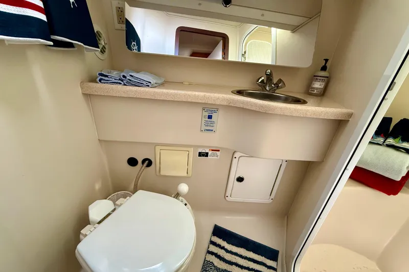 Slide: The Image of Bathroom interior of 2002 Catalina 400 MkII yacht, featuring sink, toilet, and mirror. - 41