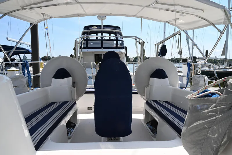 Slide: The Image of Cockpit view of 2002 Catalina 400 MkII sailboat with striped seating and covered helm. - 5