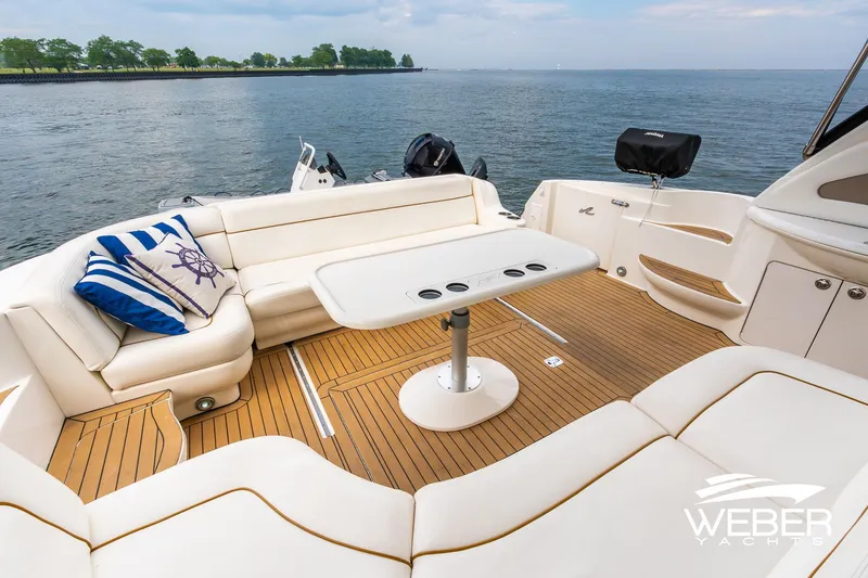 Slide: The Image of Luxurious 2000 Sea Ray Sundancer 460 yacht with elegant seating and scenic water view. - 11