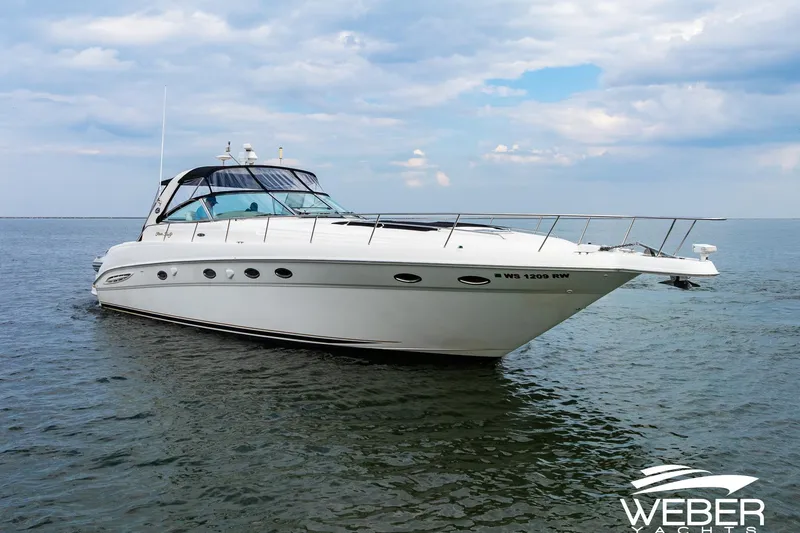 Slide: The Image of Sea Ray Sundancer 460 yacht from 2000 on open water under a cloudy sky. - 37