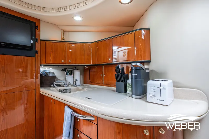 Slide: The Image of Luxurious kitchen interior of 2000 Sea Ray Sundancer 460 yacht with modern appliances. - 22