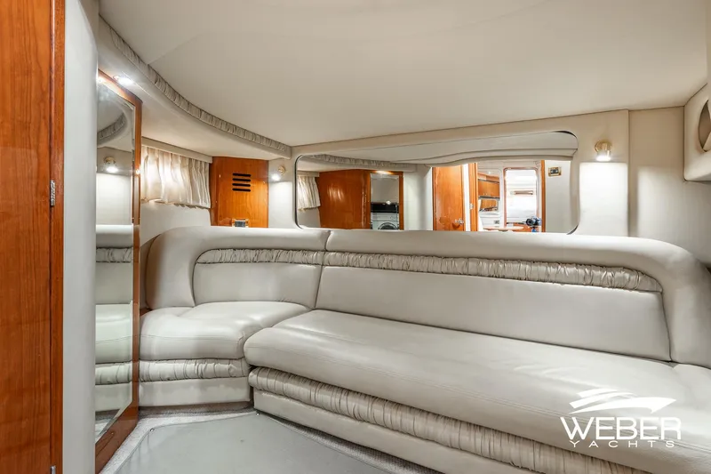 Slide: The Image of Luxurious interior of 2000 Sea Ray Sundancer 460 yacht with plush seating and elegant design. - 19