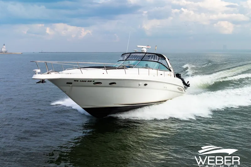 The Image of Sea Ray Sundancer 460 yacht cruising on open water, 2000 model. - 2
