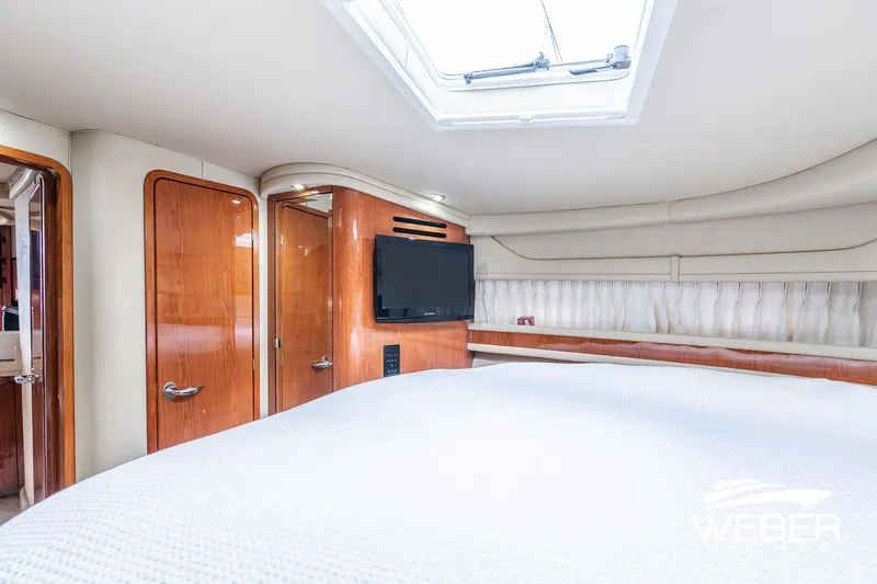 Slide: The Image of Luxurious interior of 2000 Sea Ray Sundancer 460 yacht with wood accents and skylight. - 28