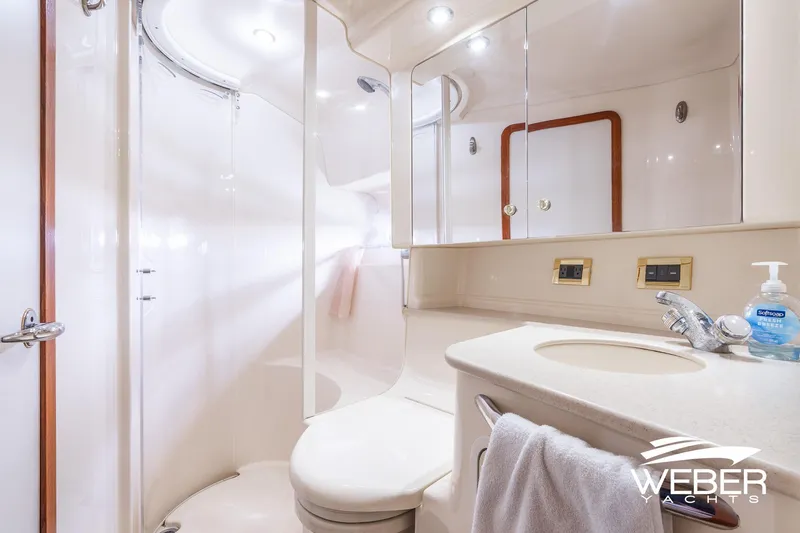 Slide: The Image of Luxurious bathroom in 2000 Sea Ray Sundancer 460 yacht, featuring modern fixtures and elegant design. - 30