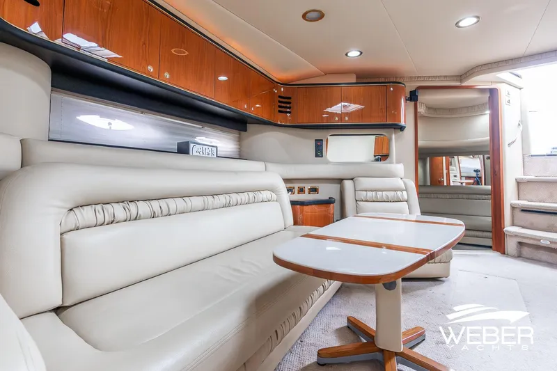 Slide: The Image of Luxurious interior of 2000 Sea Ray Sundancer 460 yacht with plush seating and elegant wood finishes. - 18