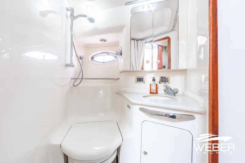 Slide: The Image of Luxurious bathroom in 2000 Sea Ray Sundancer 460 yacht with modern fixtures. - 31