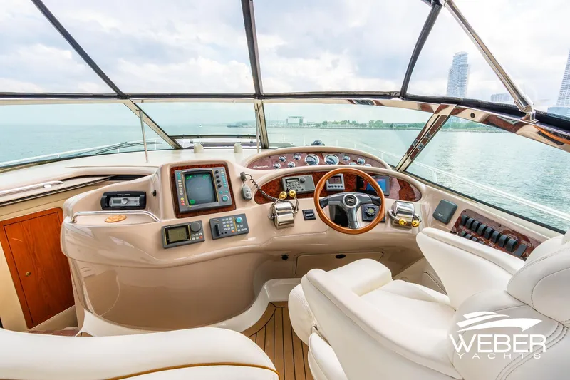 Slide: The Image of Cockpit of 2000 Sea Ray Sundancer 460 yacht with modern navigation equipment and panoramic view. - 8