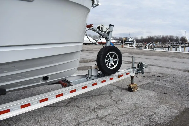 Slide: The Image of 2021 Ranger Tugs R-27 boat on trailer at marina, overcast sky. - 13
