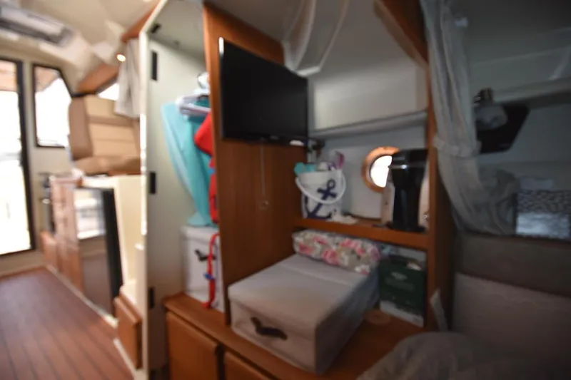 Slide: The Image of Interior of a 2021 Ranger Tugs R-27 boat with cozy living space. - 30
