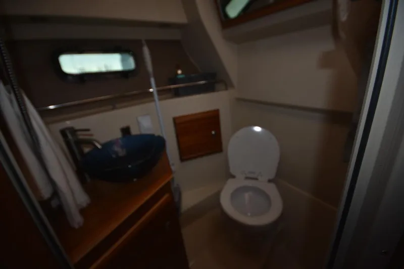 Slide: The Image of Bathroom interior of 2021 Ranger Tugs R-27 boat with toilet and sink. - 38