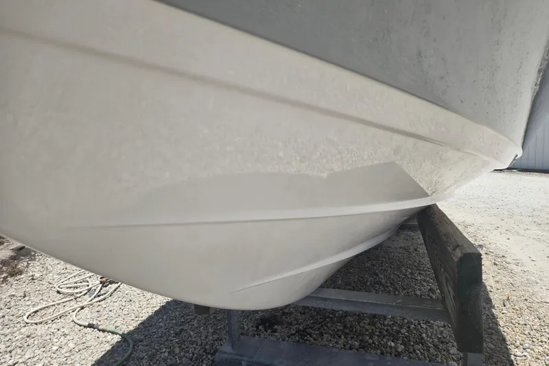 Slide: The Image of 2022 Sportsman Masters 227 Bay Boat hull on trailer, side view. - 17