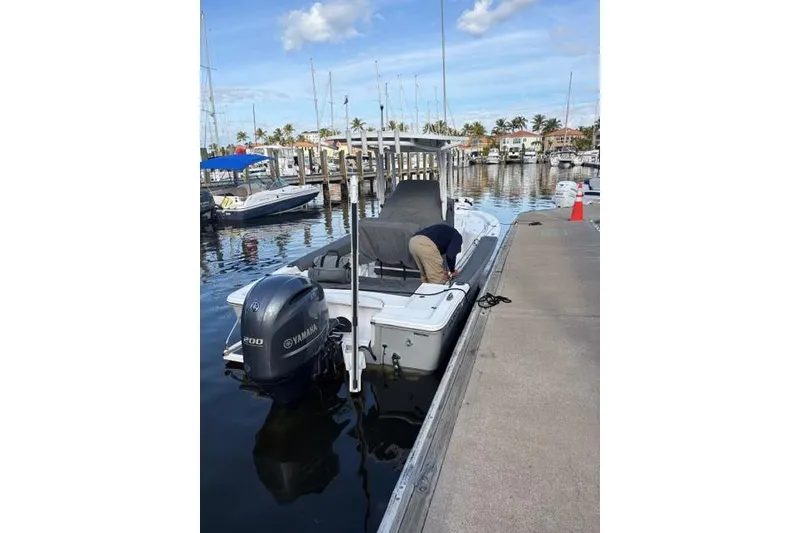 Slide: The Image of 2022 Sportsman Masters 227 Bay Boat docked with Yamaha engine. - 6