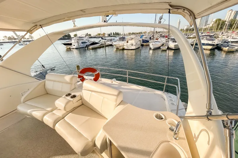 Slide: The Image of Luxurious 2003 Silverton 410 Sport Bridge yacht interior with marina view. - 24