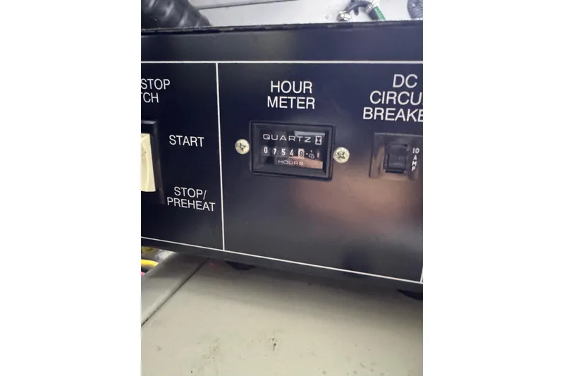 Slide: The Image of Control panel of a 2003 Silverton 410 Sport Bridge with hour meter display. - 44