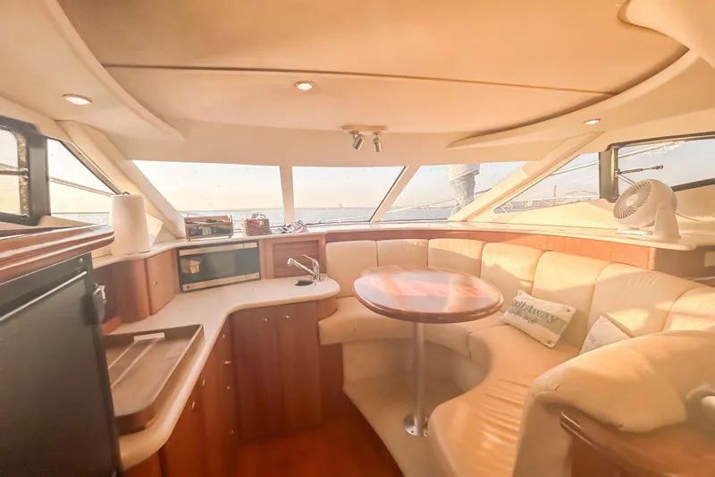Slide: The Image of Luxurious interior of a 2003 Silverton 410 Sport Bridge yacht with plush seating and modern amenities. - 67