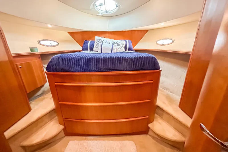Slide: The Image of Luxurious cabin interior of a 2003 Silverton 410 Sport Bridge yacht with plush bedding. - 75