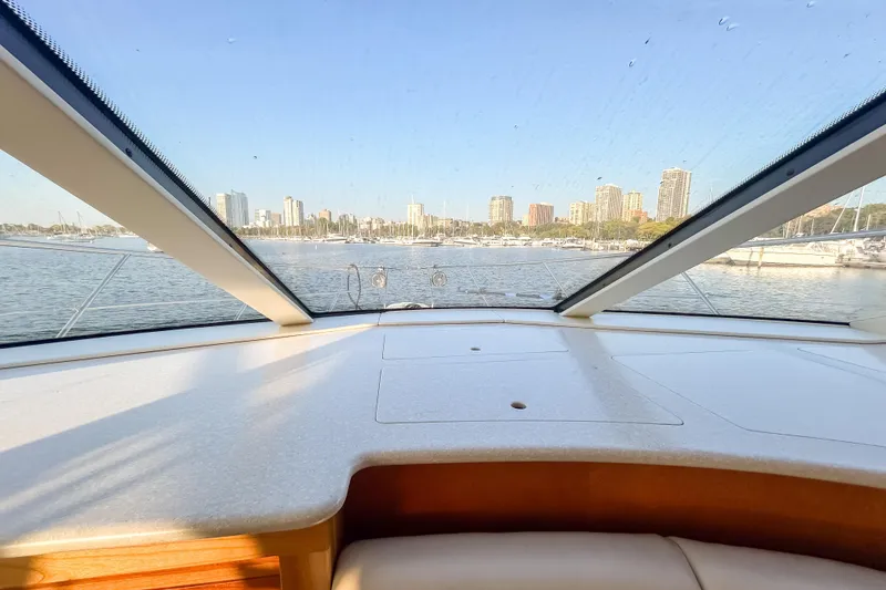 Slide: The Image of View from 2003 Silverton 410 Sport Bridge yacht, overlooking city skyline and marina. - 83